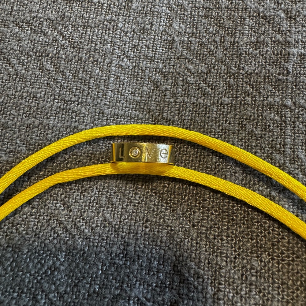 RARE Yellow gold Cartier love silk cord bracelet